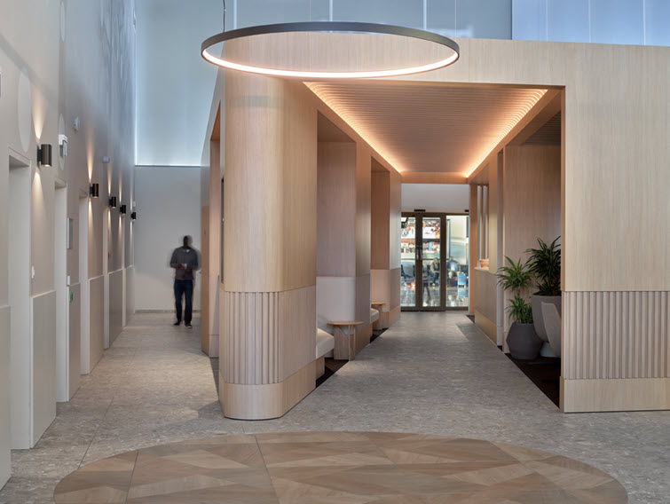 Sunrise Lounge renovation featuring HPL by Unilin Panels transports travelers to warmer destinations